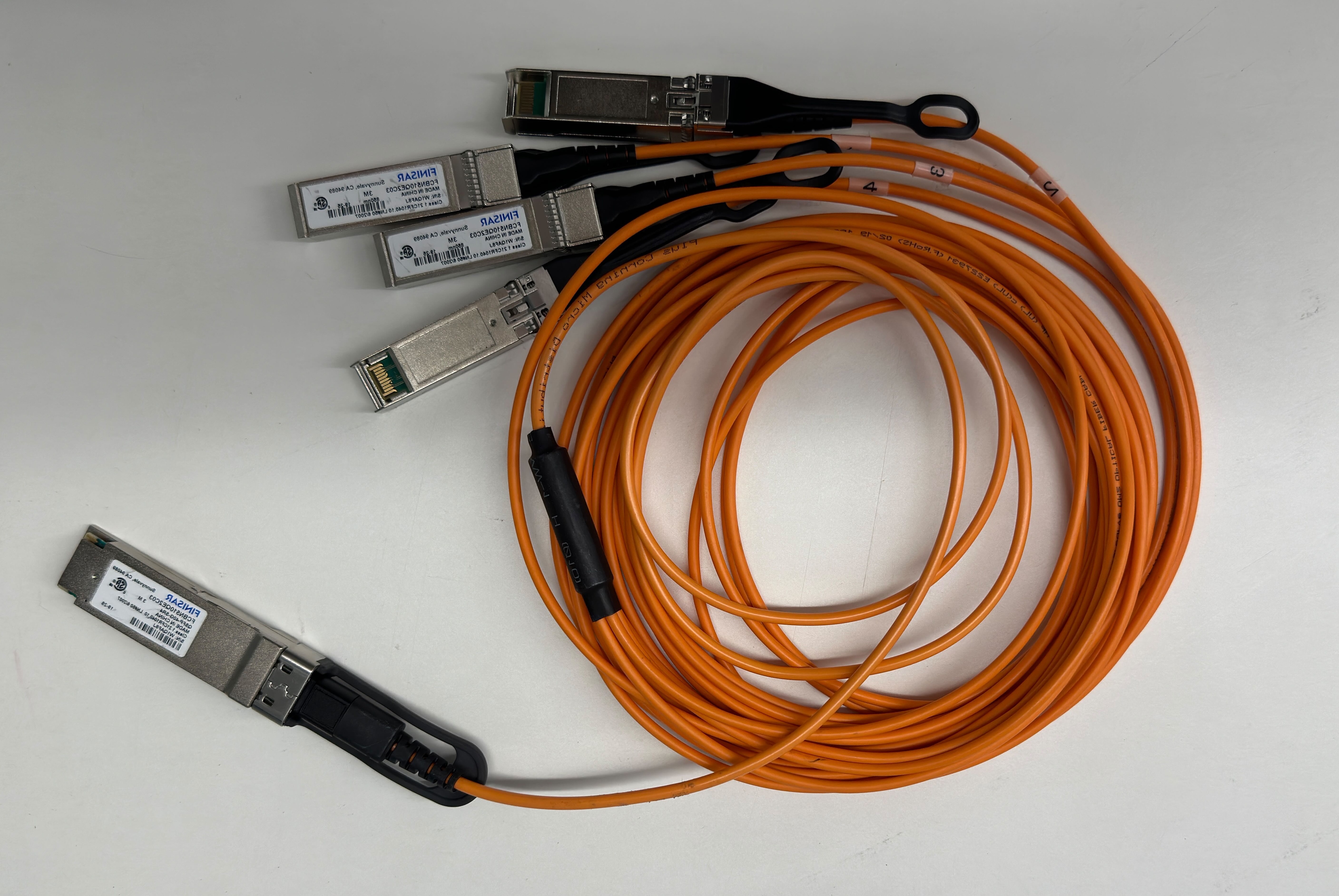 An image of a QSFP cable showing both ends.